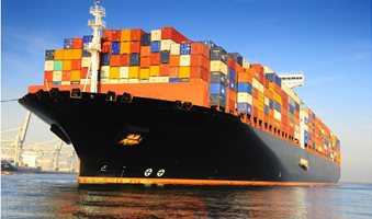 orange-black-loaded-container-ship-harbour-1950x1463