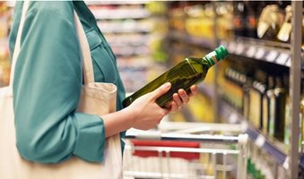 woman-grocery-shopping-olive-oil-1296x728-header-1024x576