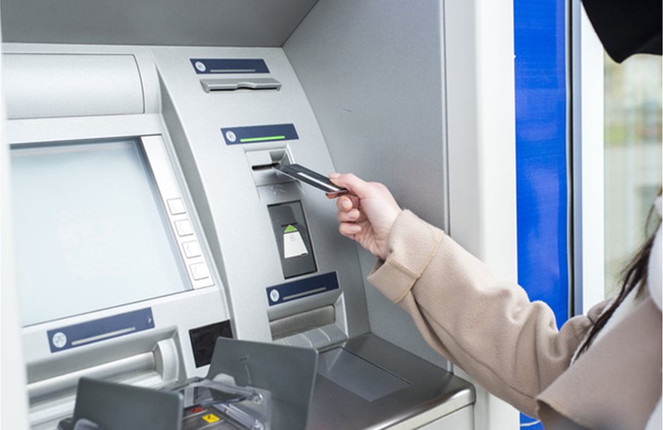 stock-photo-woman-using-the-atm_2